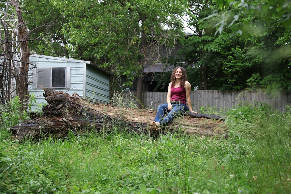 Amanda Beltramini Healan poses on a fallen her backyard in Nashville, Tenn., Monday,...