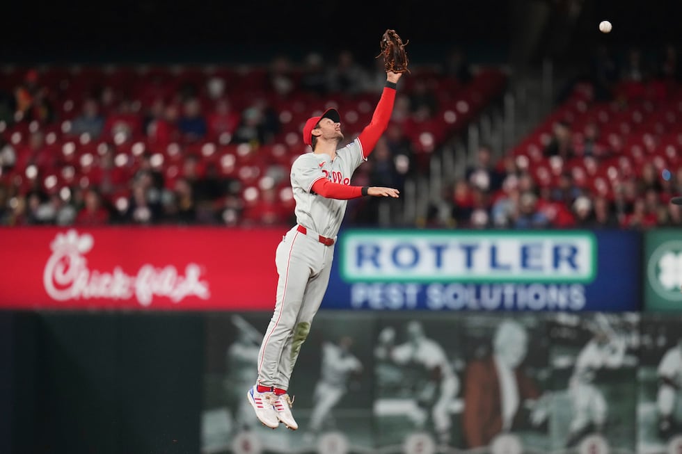 Philadelphia Phillies shortstop Trea Turner is unable to reach a single by St. Louis...