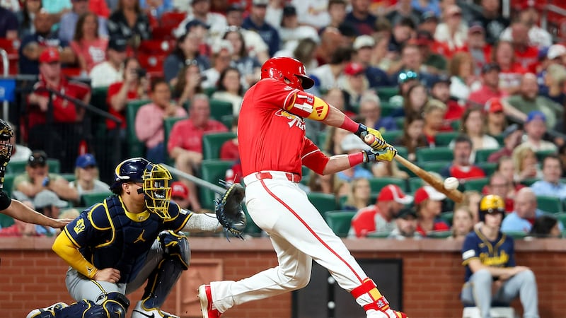 St. Louis Cardinals' Lars Nootbaar, right, hits an RBI single during the fifth inning of a...