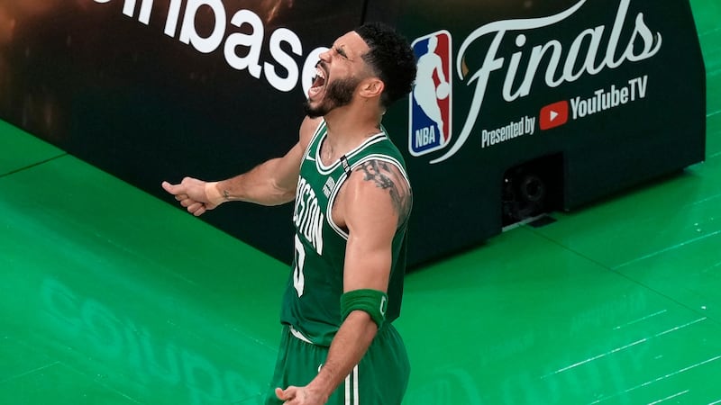 Boston Celtics' Jayson Tatum celebrates after scoring during the first half of Game 5 of the...