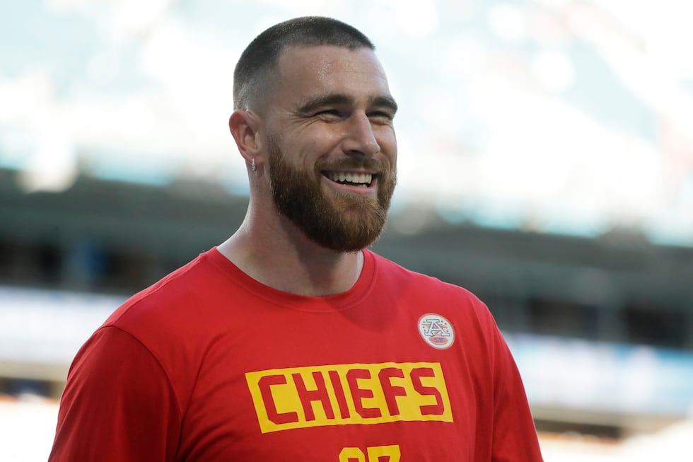 FILE - Kansas City Chiefs' Travis Kelce smiles before the NFL Super Bowl 54 football game...