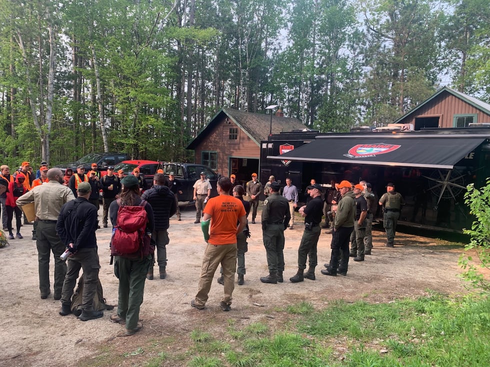 Searchers were receiving a briefing from Baxter State Park Rangers and the Maine Warden...