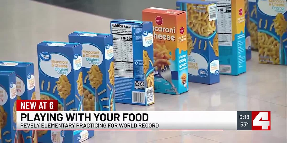 Stacking food boxes to break a world record and help those in need