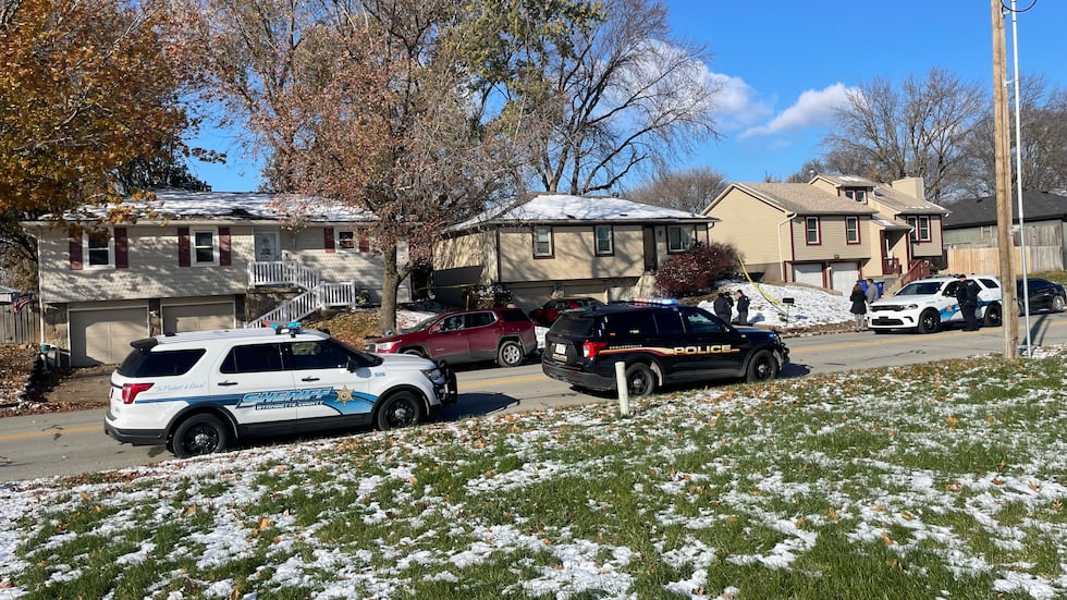 Police set up a crime scene outside the home of former KCKPD detective Roger Golubski.