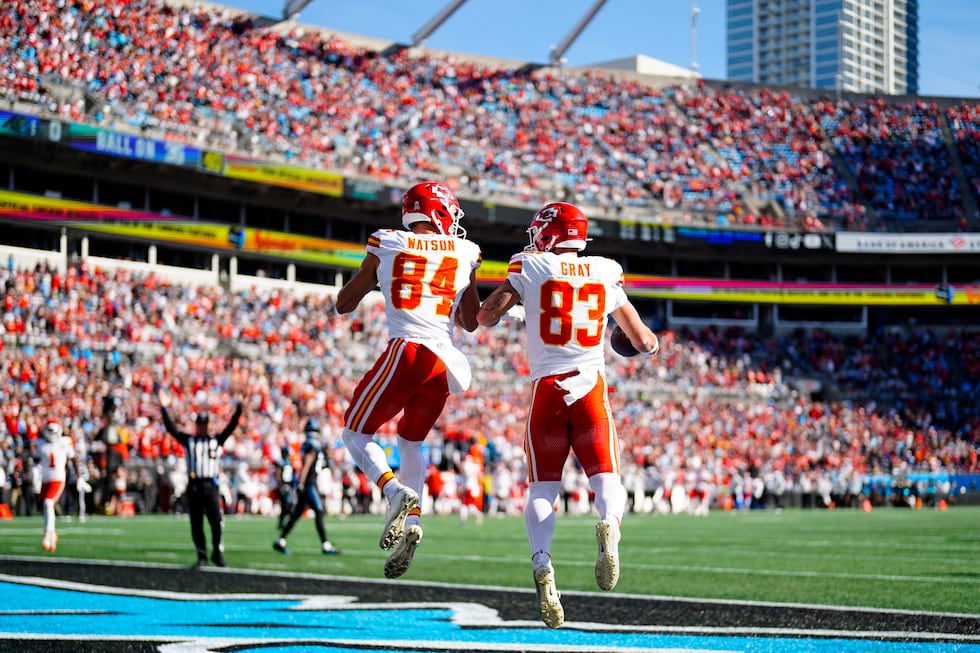 Kansas City Chiefs tight end Noah Gray (83) celebrates his touchdown with Justin Watson (84)...