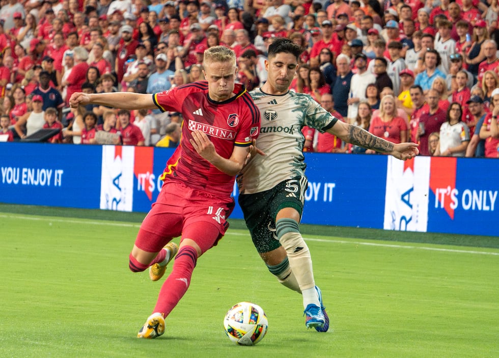 Right-back Tomas Totland fights for the ball against Portland's Claudio Bravo.
