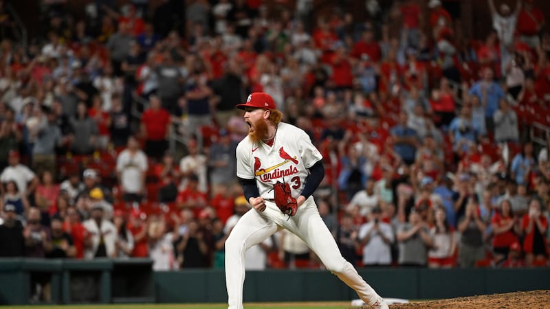 St. Louis Cardinals starting pitcher Dustin May celebrates after the team defeated the San...