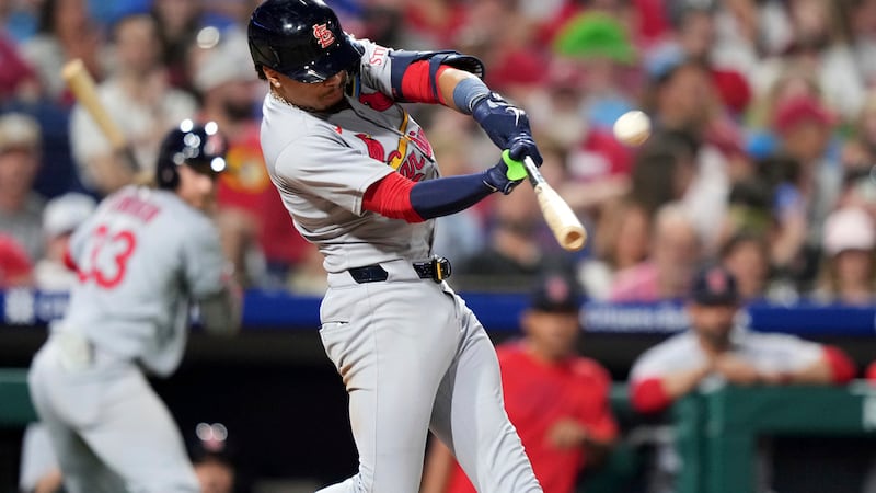 St. Louis Cardinals' Masyn Winn hits a home run against Philadelphia Phillies pitcher Matt...