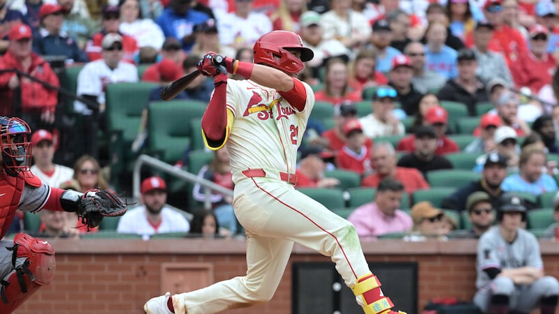 St. Louis Cardinals' Lars Nootbaar, right, hits a two RBI single during the sixth inning of a...