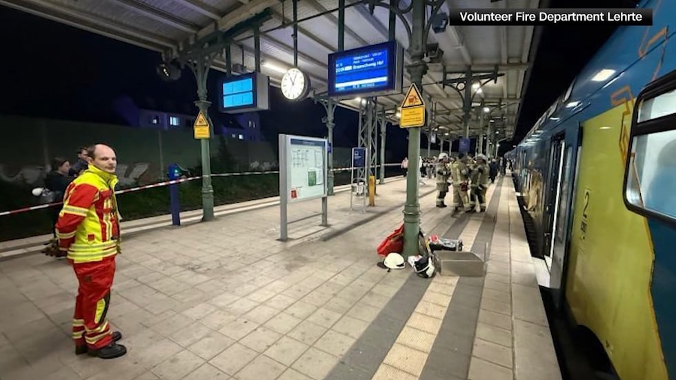 Firefighters freed a man who got his arm stuck under a train armrest while trying to find his...