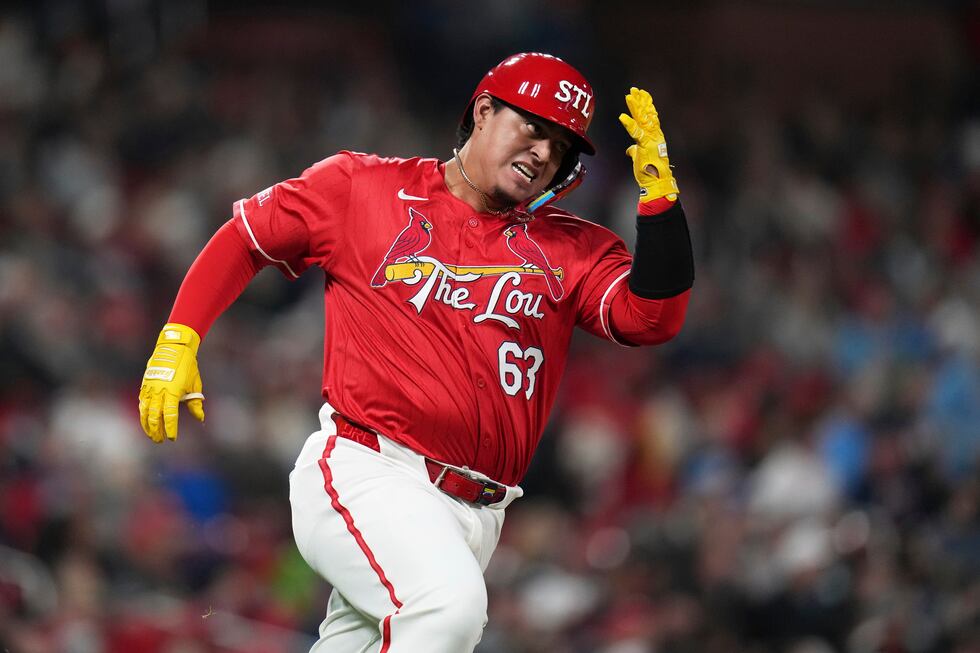 St. Louis Cardinals' Yohel Pozo rounds first on his way to an RBI double during the fifth...