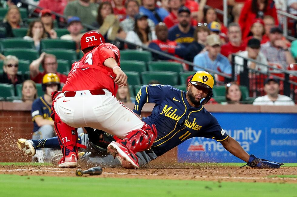 St. Louis Cardinals catcher Pedro Pagés, left, tags out Milwaukee Brewers' Jackson Chourio at...