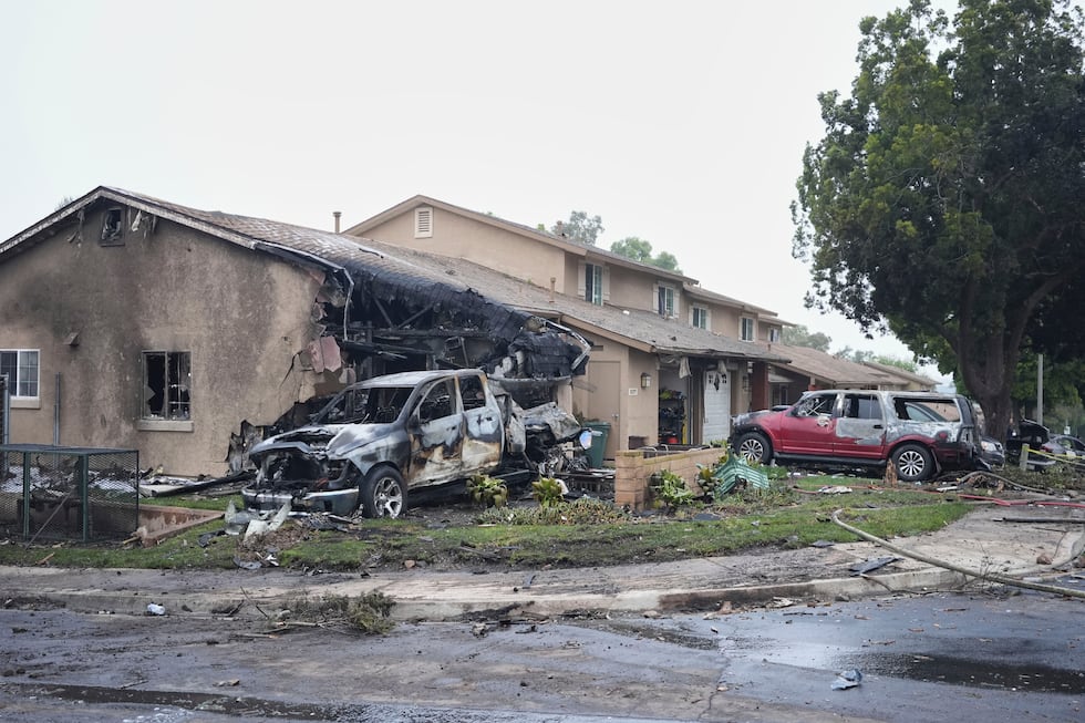 Vehicles and houses are damages after a small plane crashed into a San Diego neighborhood,...