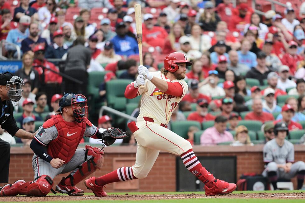St. Louis Cardinals' Brendan Donovan (33) hits a single during the third inning of a baseball...