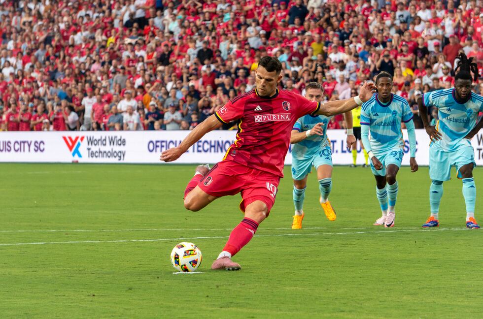 Midfielder Eduard Löwen strikes a penalty kick against the Colorado Rapids.