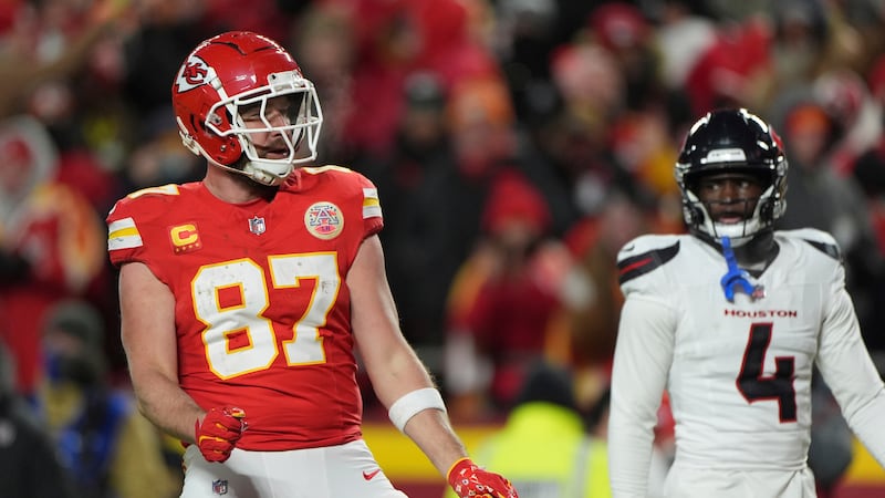 Kansas City Chiefs tight end Travis Kelce celebrates gaining a first down as Houston Texans...
