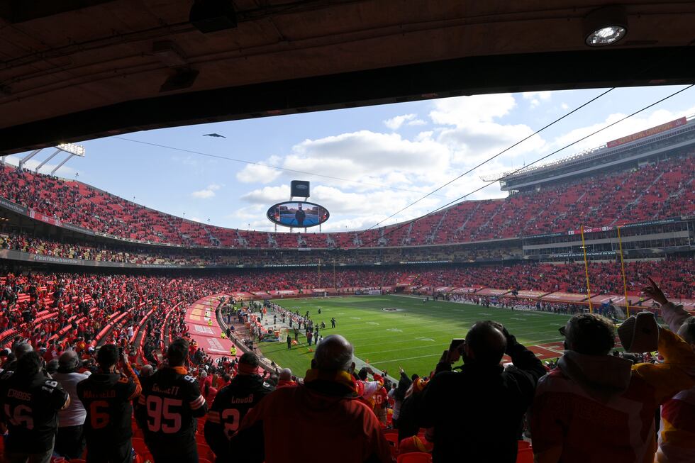 Fans cheer in Arrowhead Stadium during a flyover before an NFL divisional round football game...