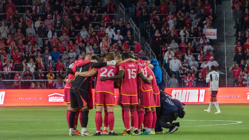 A team huddle before kick-off.
