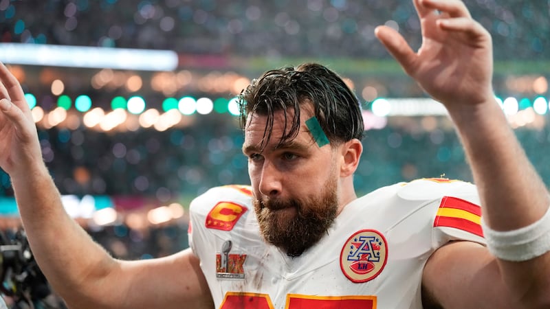 Kansas City Chiefs tight end Travis Kelce walks off the field after a loss to the Philadelphia...