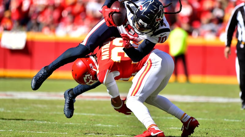 Houston Texans wide receiver DeAndre Hopkins (10) is upended by Kansas City Chiefs safety...
