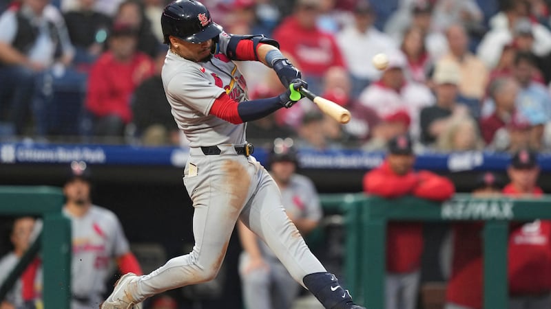 St. Louis Cardinals' Masyn Winn hits ahome run against Philadelphia Phillies pitcher Aaron...