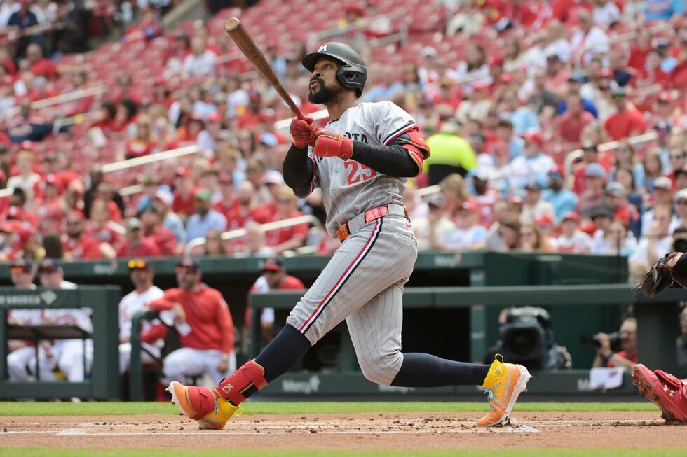 Minnesota Twins' Byron Buxton (25) hits an RBI double during the first inning of a baseball...