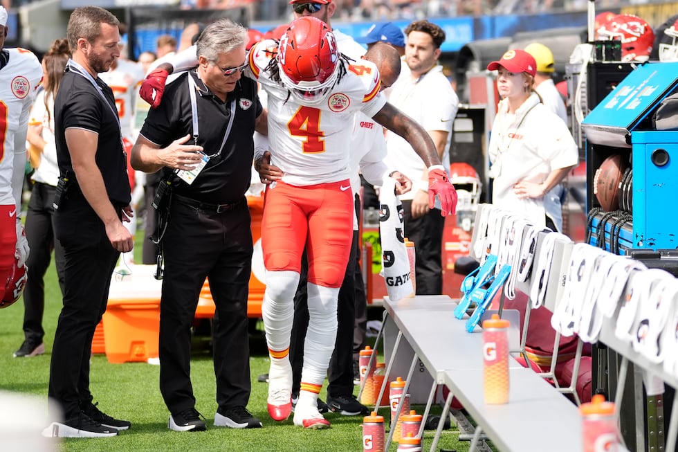 Kansas City Chiefs wide receiver Rashee Rice (4) is assisted after being injured during the...