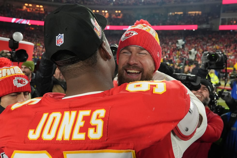 Kansas City Chiefs tight end Travis Kelce, right, celebrates with teammate Chris Jones fter...