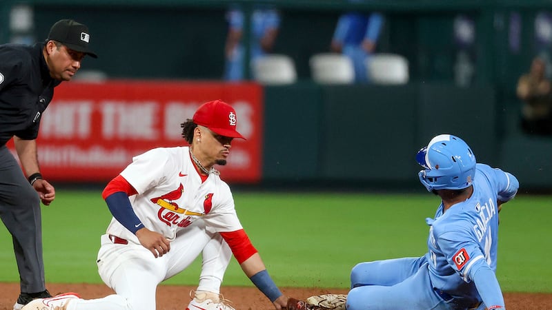 St. Louis Cardinals' Masyn Winn is late with the tag as Kansas City Royals' Maikel Garcia...
