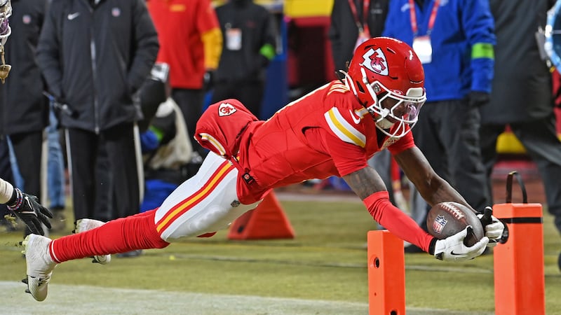Kansas City Chiefs wide receiver Xavier Worthy (1) dives into the endzone for a touchdown...