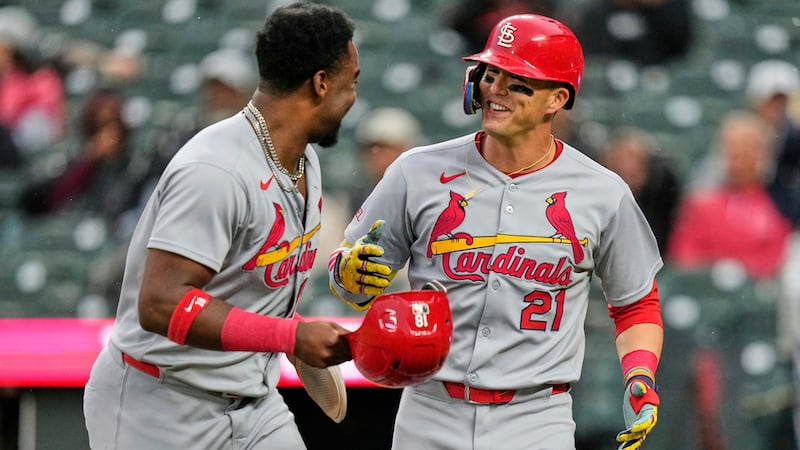St. Louis Cardinals' Lars Nootbaar (21) celebrates with Jordan Walker, left, after hitting a...