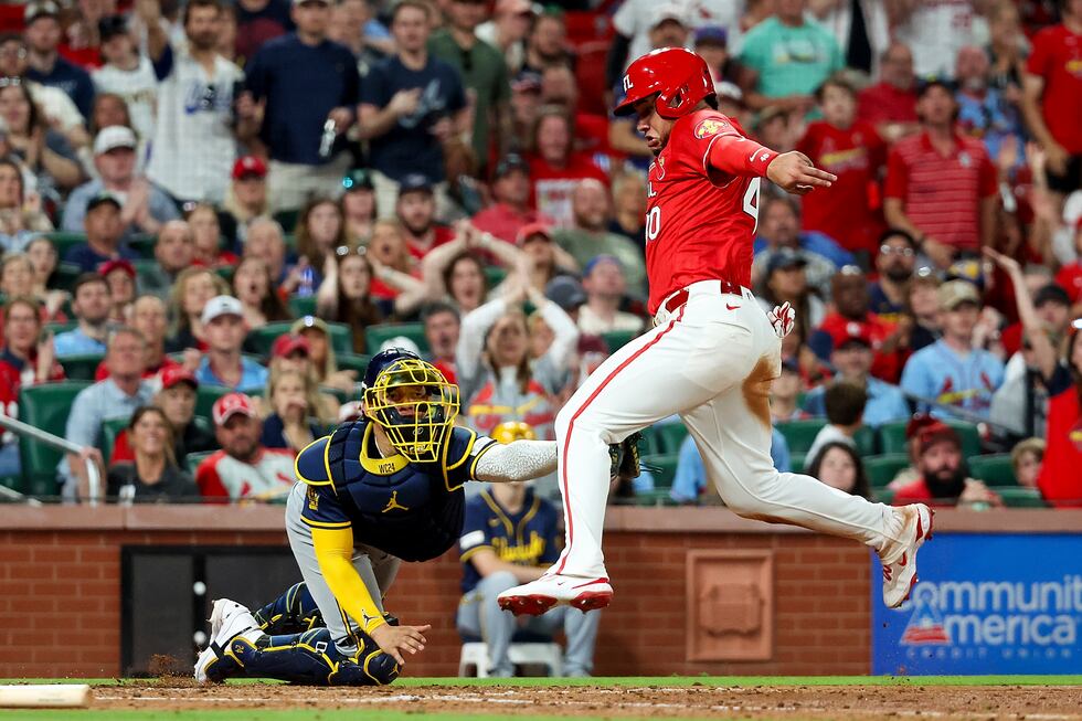 Milwaukee Brewers catcher William Contreras, left, tags out St. Louis Cardinals' Willson...