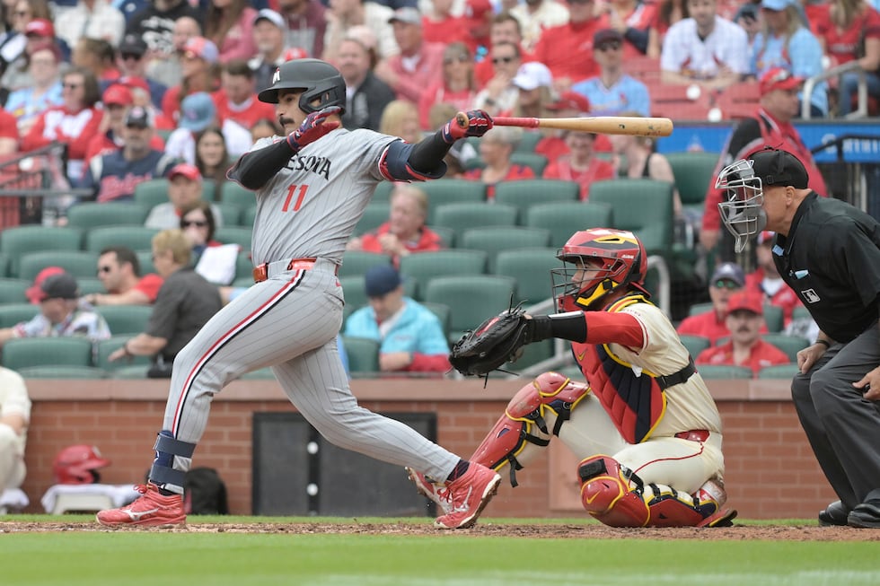 Minnesota Twins' Mickey Gasper (11) hits a single during the eighth inning of a baseball game...