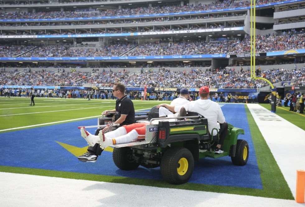 Kansas City Chiefs wide receiver Rashee Rice is taken off the field on a cart after being...