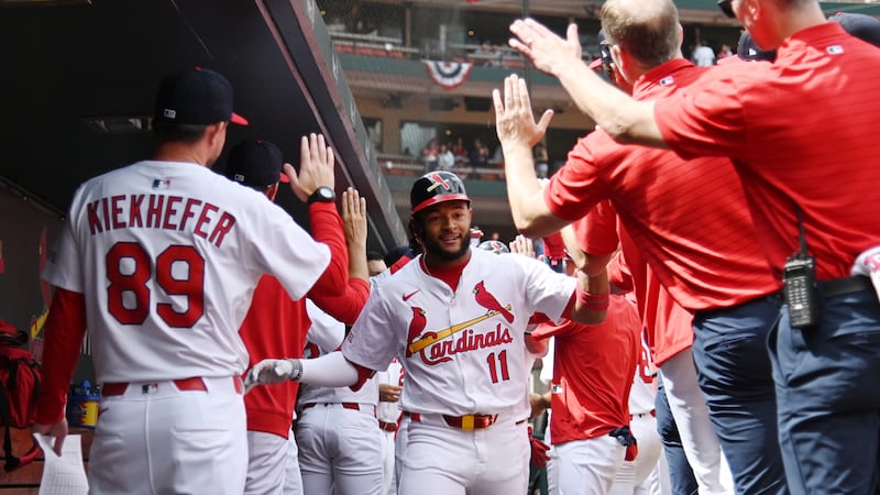 St. Louis Cardinals' Victor Scott II (11) celebrates with teammates after hitting a two-run...