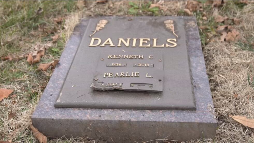 Karen Daniels said her family was told a mower ran over her father's gravestone and cracked a...