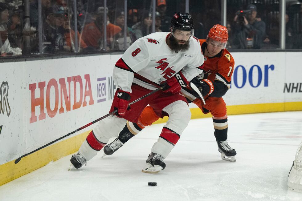 Carolina Hurricanes defenseman Brent Burns (8) controls the puck as Anaheim Ducks center...