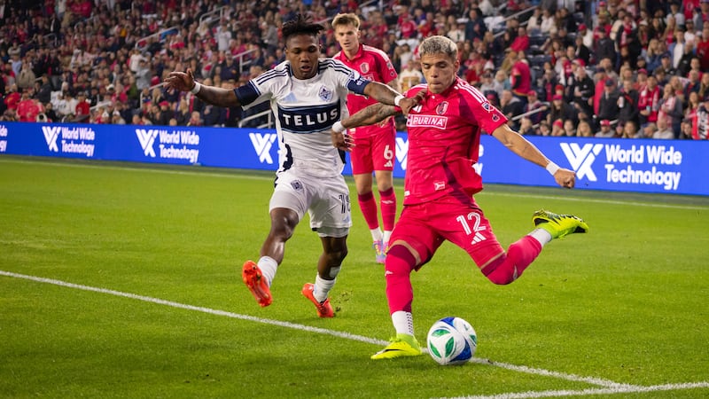 St. Louis CITY SC's Célio Pompeu battles against the Whitecaps' Édier Ocampo. CITY's Conrad...
