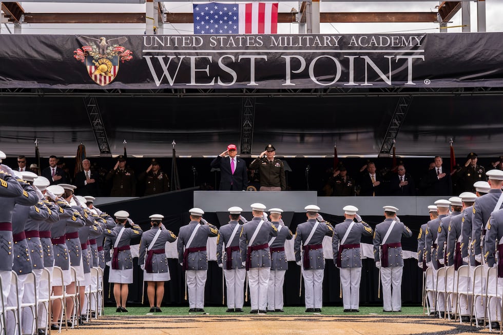President Donald Trump salutes alongside Lieutenant General Steven W. Gilland during the U.S....