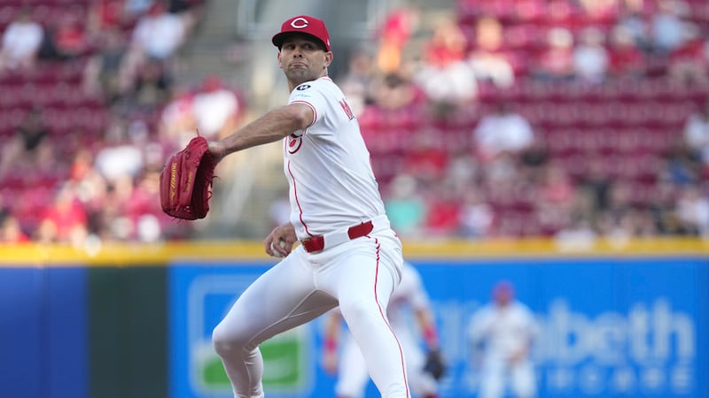 Cincinnati Reds' Nick Martinez delivers a pitch in the first inning of a baseball game against...