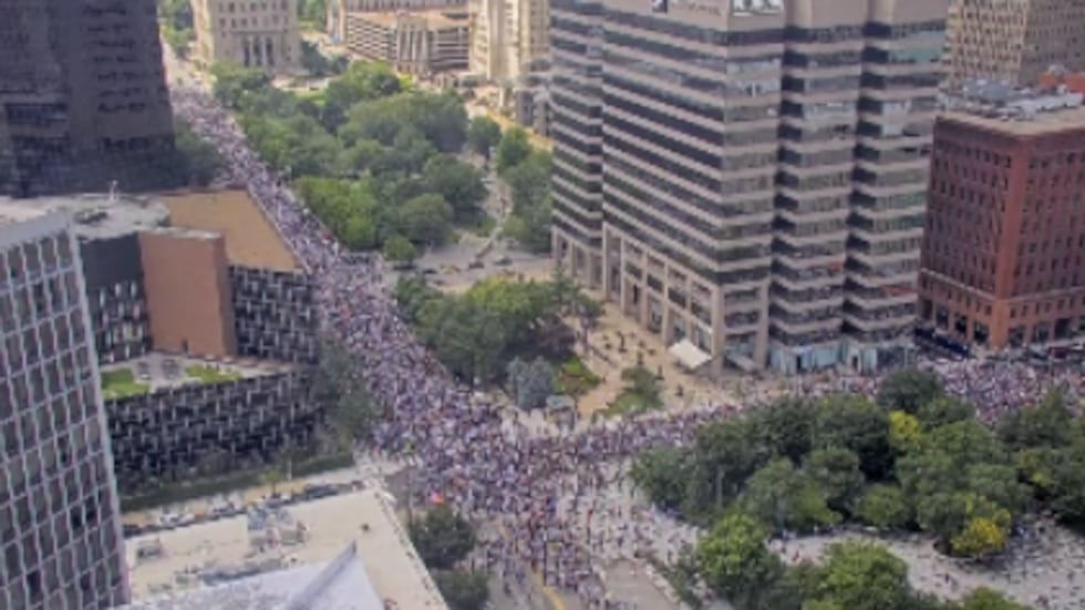 Protest causes traffic delays as people march down Market Street in downtown St. Louis.